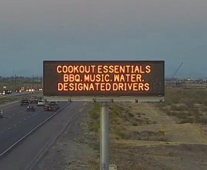 A digital message board on the highway encourages motorists to designate a driver.