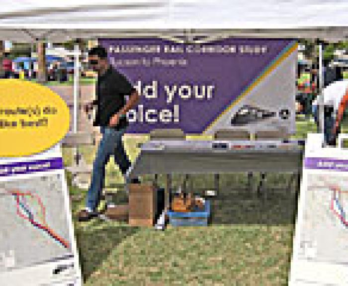 Passenger rail booth at community event