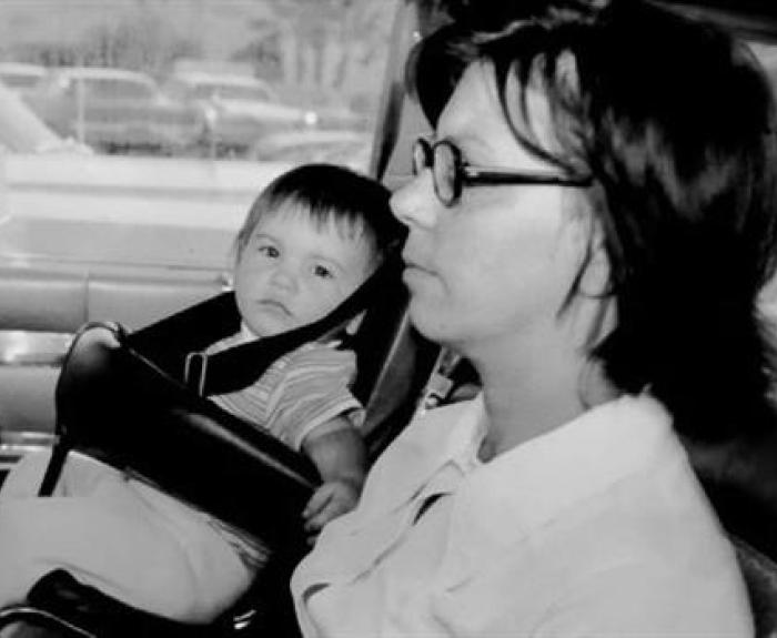 b/w photo of a child seat in the front of a car