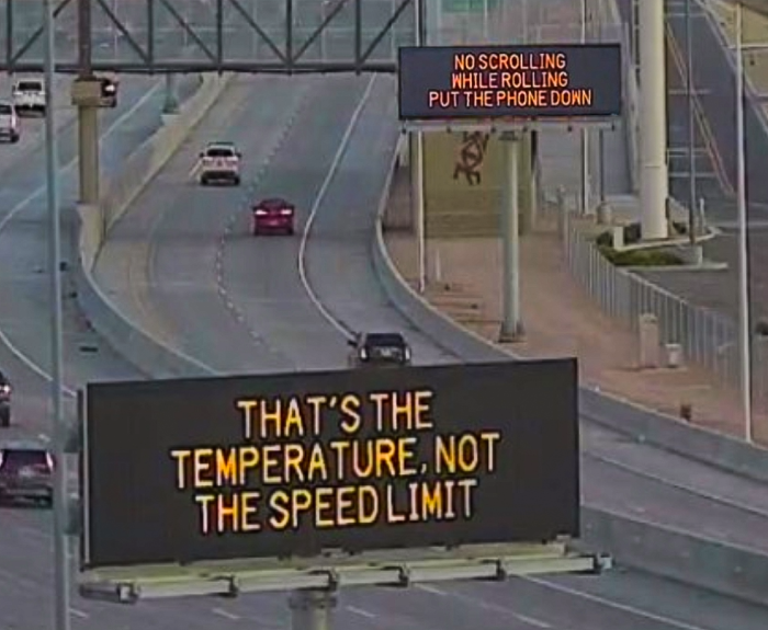 Digital message boards on the highway encourages motorists to slow down and put the phone down