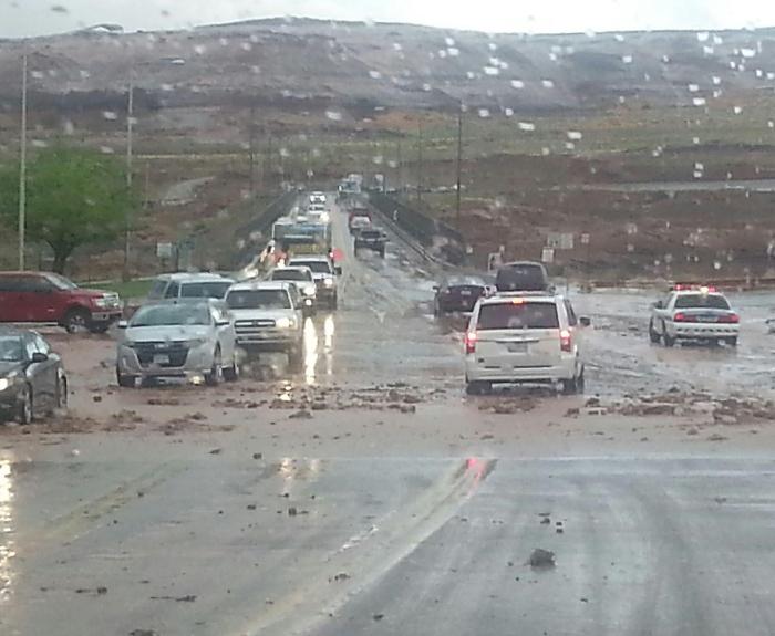 mud and rocks blocked the roadway near Glen Canyon Dam