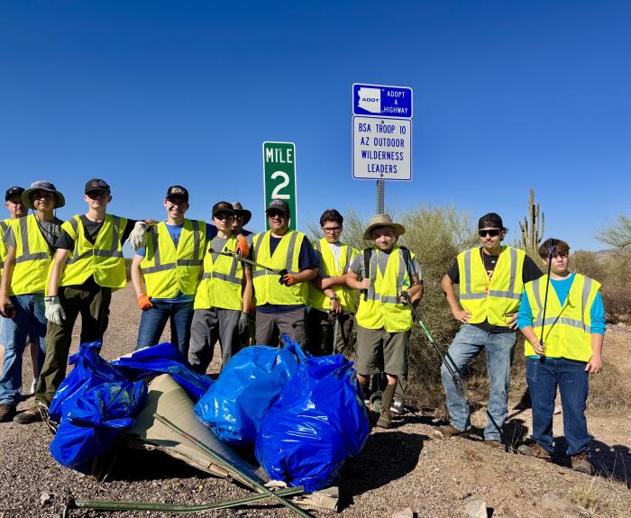 Troop 10 from Mesa in front of their Adopt a Highway recognition sign on State Route 88