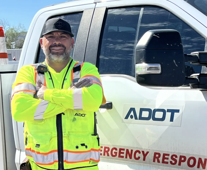 ADOT's Karl Lopez stands in front of his emergency response truck