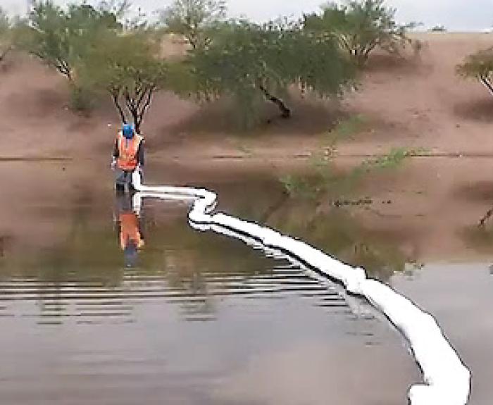 ADOT Hazmat Crew member cleans the site after a major crash