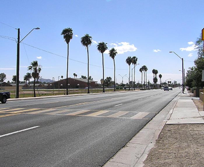 Palm trees line State Route 387 in Casa Grande.