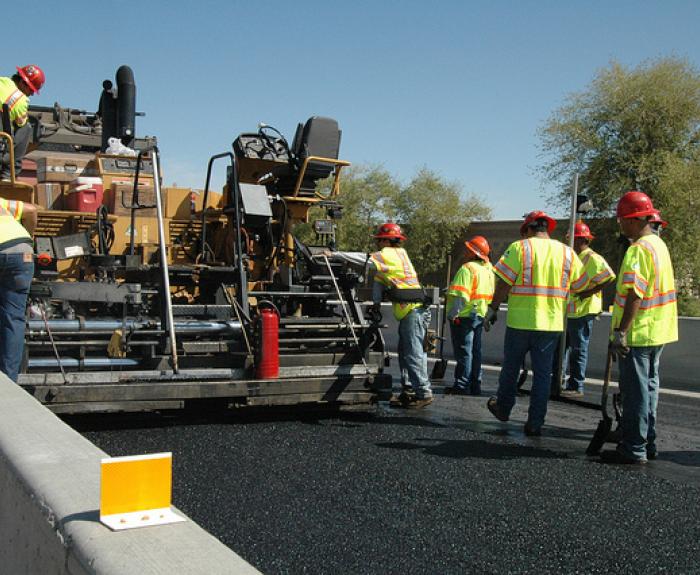 Crew paves with rubberized asphalt