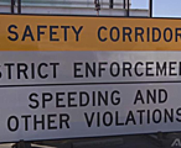 Sign reading Safety Corridor Strict Enforcement.