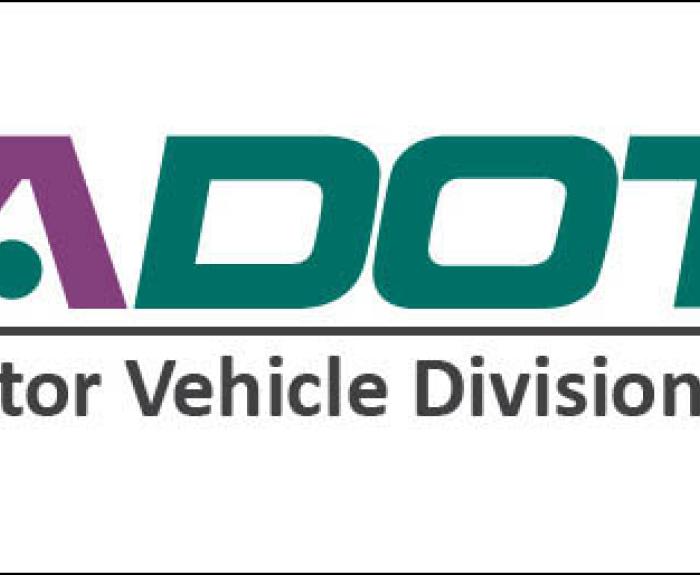 ADOT Motor Vehicle Division logo with ADOT in bold green and purple capital letters above the words Motor Vehicle Division in gray.