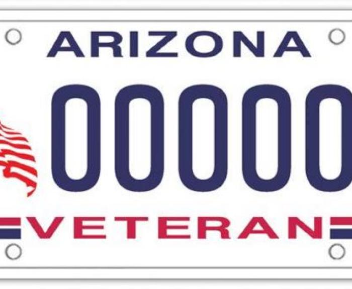 Arizona license plate featuring an American flag on the left and the word Veteran in red at the bottom. The plate number is all zeros.