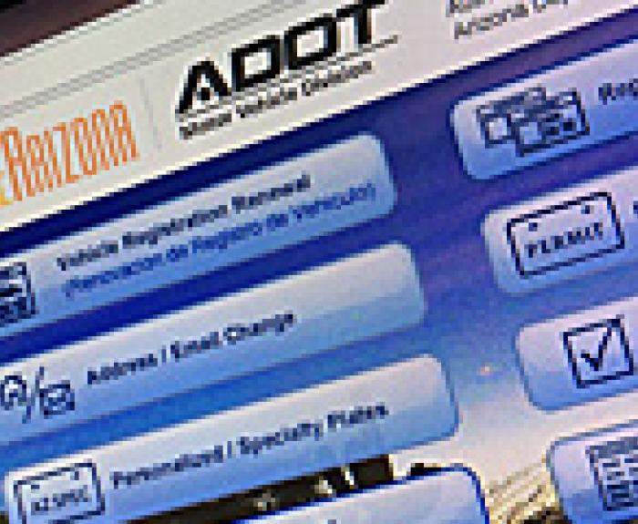 A close-up of the ServiceArizona website for the Arizona Department of Transportation, showing online service options like vehicle registration renewal and address change.