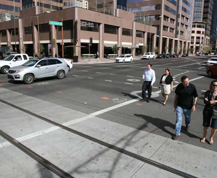People using crosswalk in city