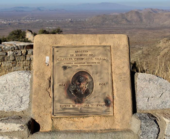A plaque honors Charles Churchill Small Father of Arizona Highways with mountains and desert in the background.