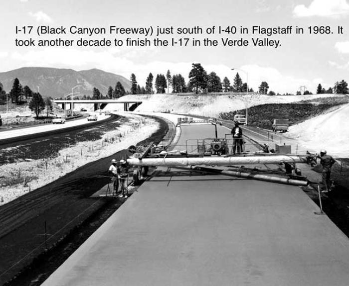 Black and white photo of the I-17 freeway under construction near I-40 in Flagstaff, Arizona, in 1968, with workers and equipment paving the roadway.