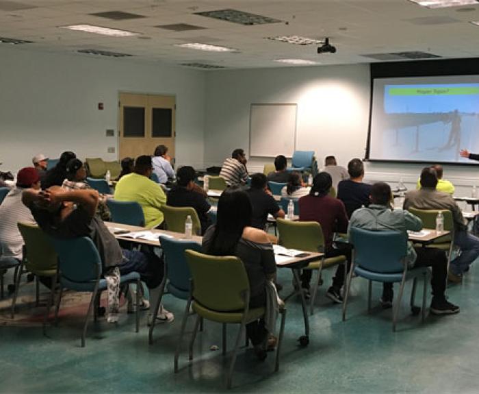 Construction Academy classroom with attendees