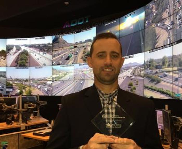 Wrong Way System award and man holding it