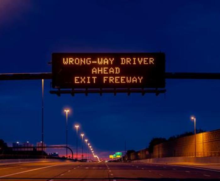 Wrong-way driver warning on freeway message board