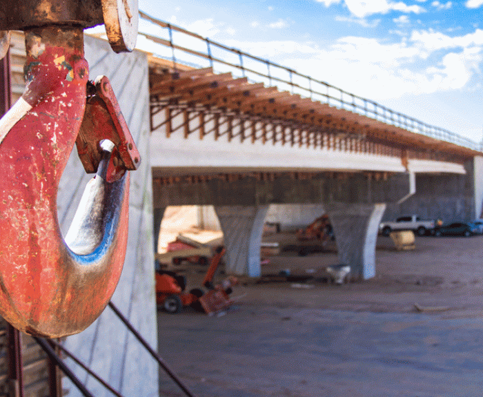 Close up of hook on machinery by bridge