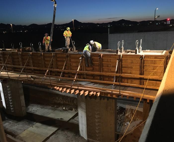 Crew members work on deck of Pinnacle Peak bridge