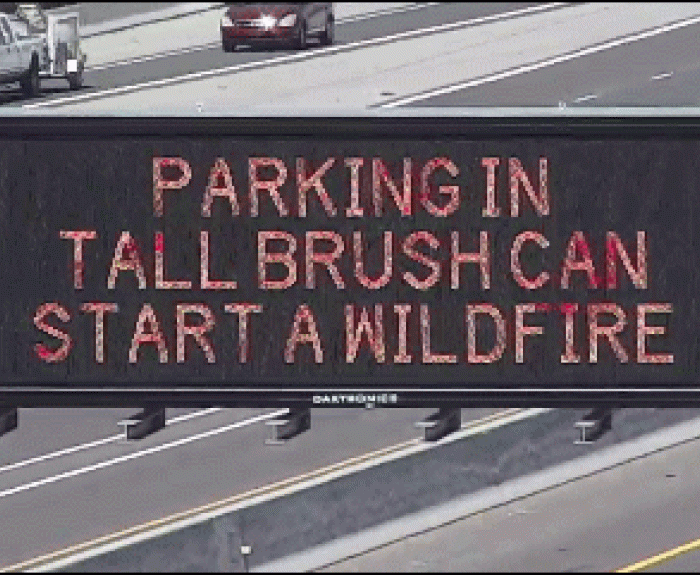 Freeway message board carrying message about wildfire prevention