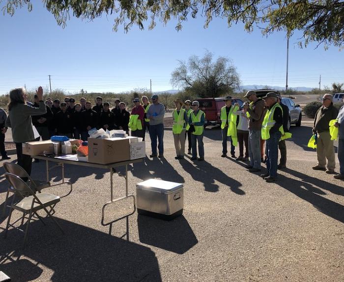 People gathered for safety briefing before State Route 286 cleanup