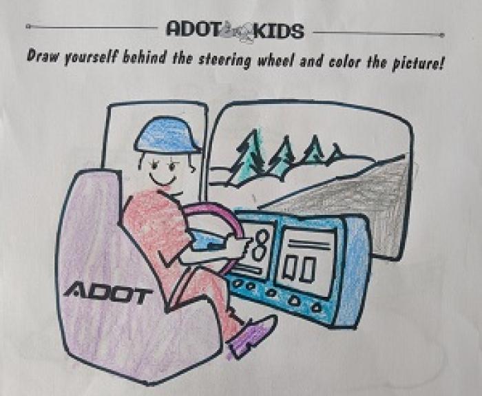 ADOT Kids Color Drawing behind the steering wheel of a snowplow