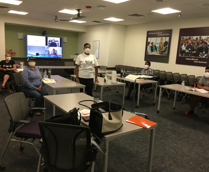 Masked participants in Construction Academy classroom