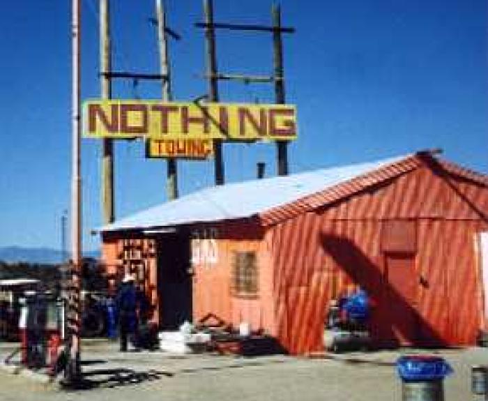 Sign for Nothing, Arizona, and red building