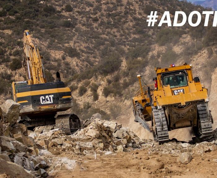 Adot kids image road construction heavy equipment moving bouders.