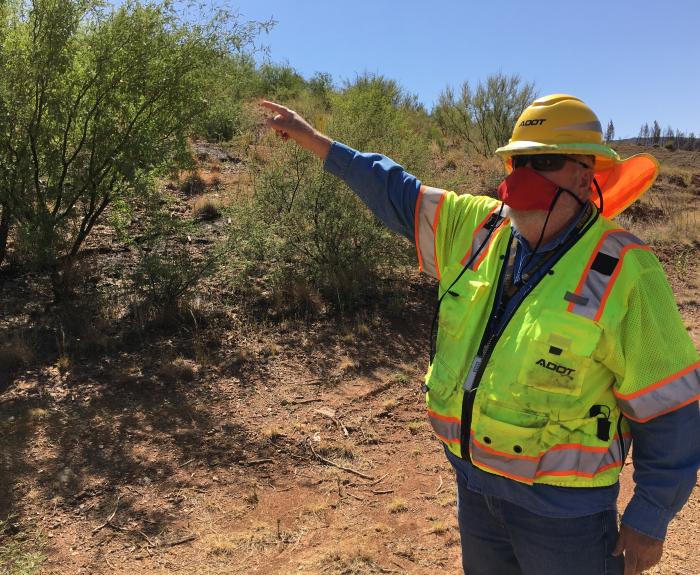ADOT Geologist Studies the earth rocks on-site