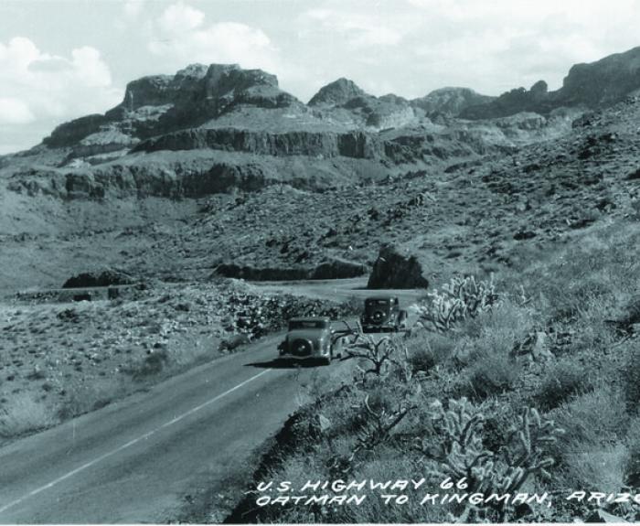 Black and white historic image of a vehicle on Route 66