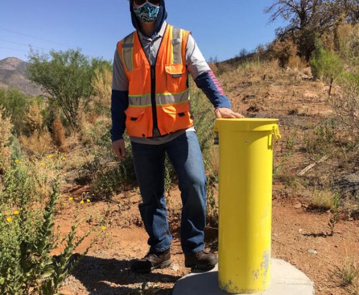 An ADOT engineer in training is shown at a project site.