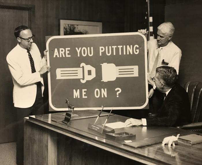 "Are you putting me on?" seat belt safety sign displayed for Governor Jack Williams