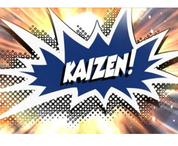 Comic-style explosion graphic with the word KAIZEN! in bold white letters on a blue background, surrounded by bright, radiating lines and dots.