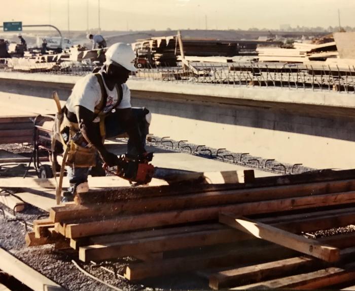 Construction worker next to materials