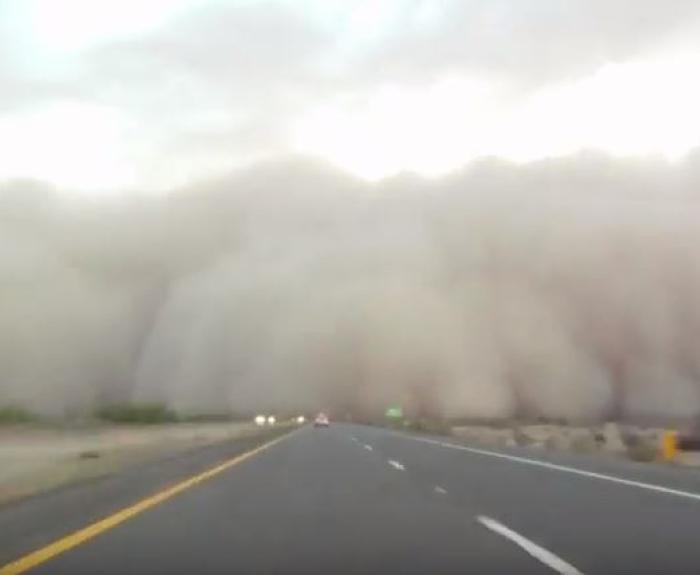 Dust cloud crossing freeway