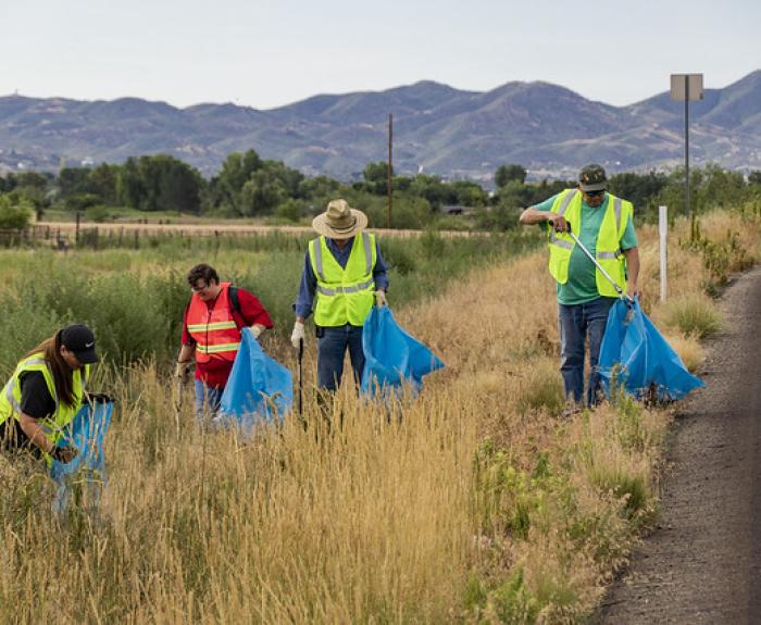Volunteers pick up litter along highway