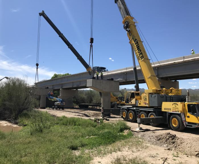 Crane sets a bridge girder
