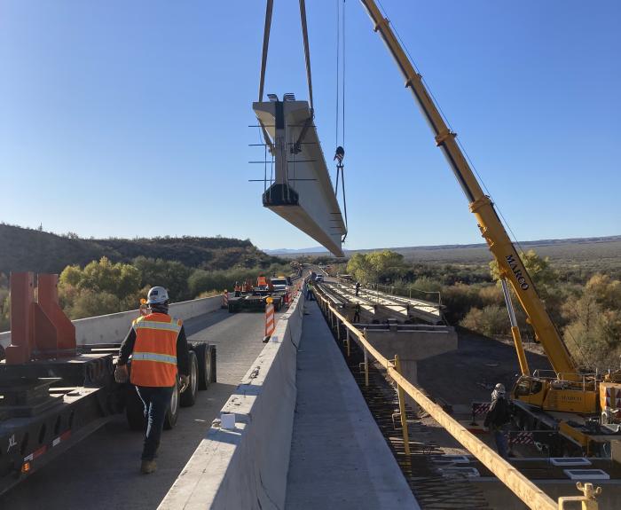 Crane sets a bridge girder