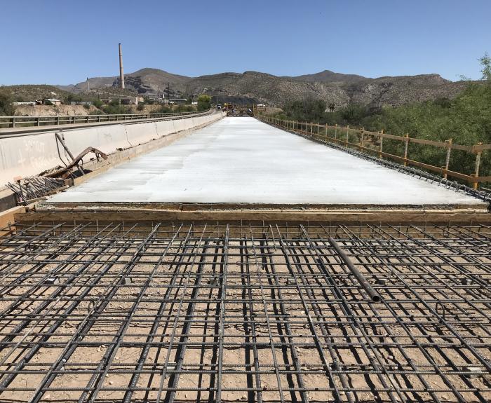 New concrete lies next to rebar set for next pour