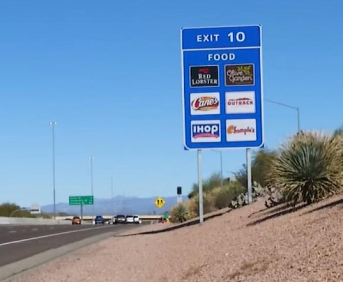 Logo sign next to freeway
