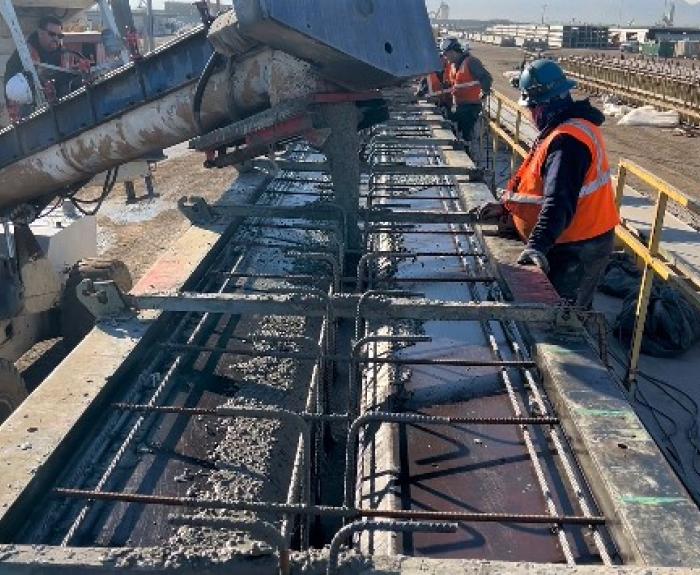 Pouring concrete to create a girder