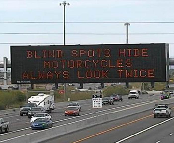 Freeway board with motorcycle safety message