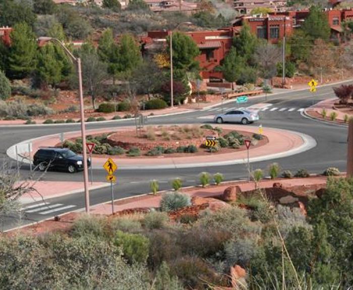 Vehicles negotiate a roundabout
