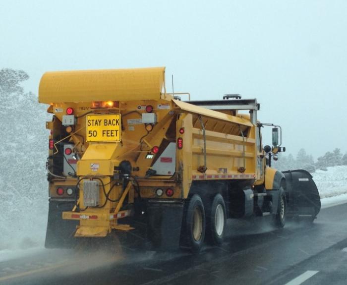 Snowplow clearing highway