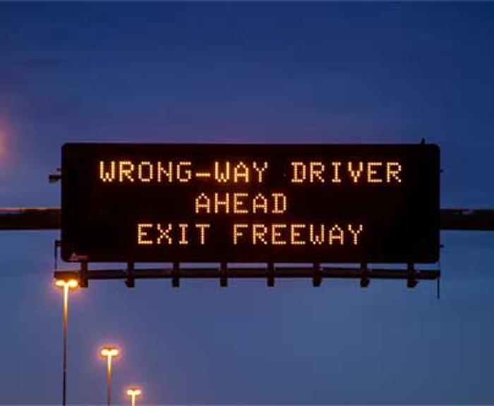 Wrong way driver warning on message board