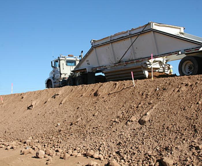 Belly dump truck at work
