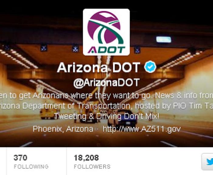 Arizona DOT Twitter profile banner featuring a lit road tunnel and official logo at the top center.