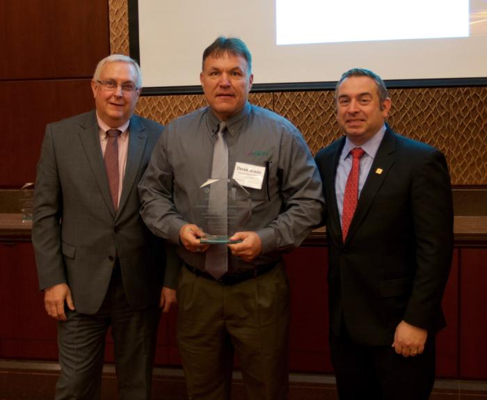 ADOT's Derek Arnson receiving award