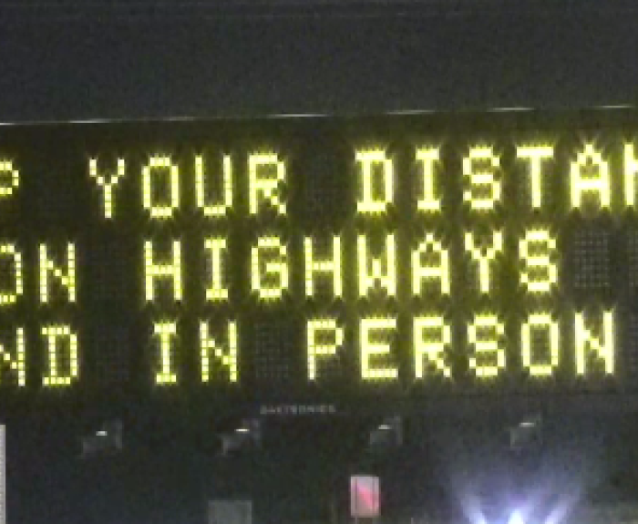 Freeway board with message on highway safety and COVID-19 safety