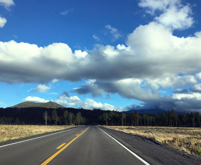 US 180 with forest and mountains in the background